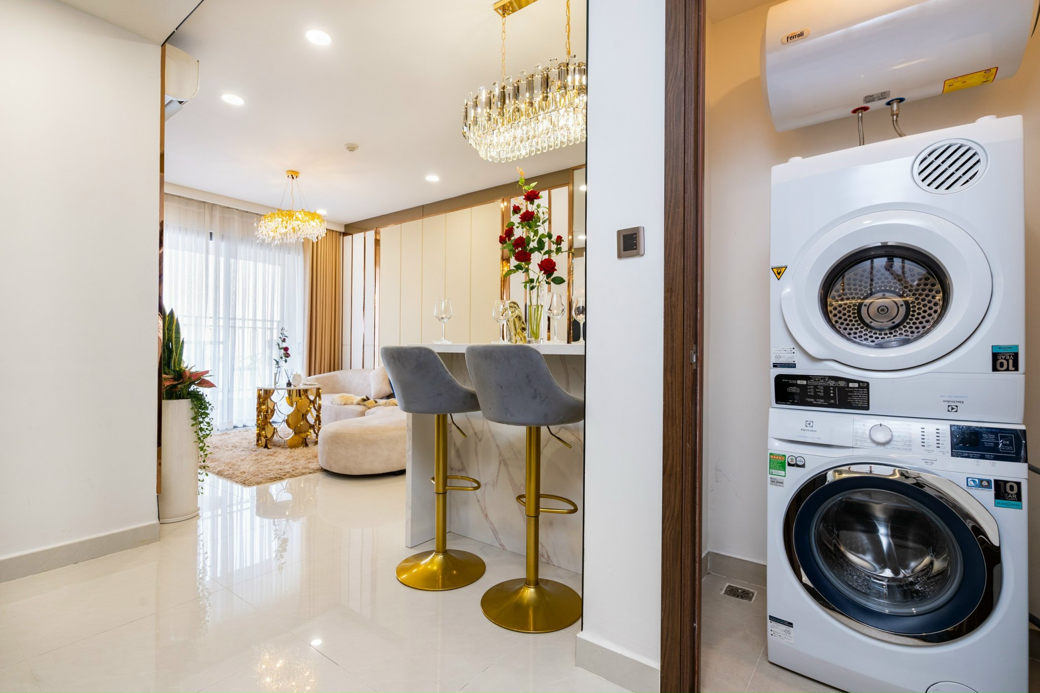 The kitchen area, washing machine and dryer